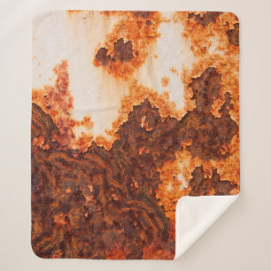 Een oude roestkleurige vlek op het oppervlak sherpa deken