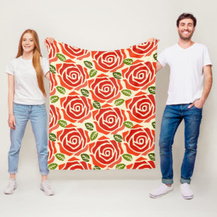 Een patroon van grote rozen rode, groene en witte  fleece deken