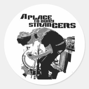 Een plek om vreemdelingen te begraven ronde sticker