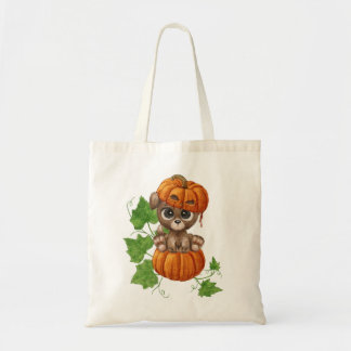 Een puppy met grote ogen in een pompoen pet tote bag