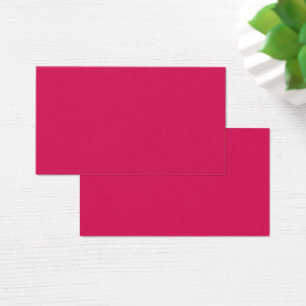 Een reeks rode en roze bloemen met weelderige groe visitekaartje