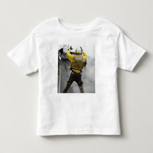 Een regisseur van het vliegtuig signaleert een Hor Kinder Shirts