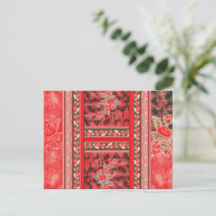 Een rood en groen bloemontwerp op een zwarte achte briefkaart