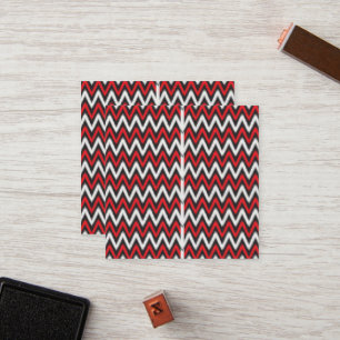 Een rood en zwart zigzagpatroon op een witte achte klantenkaartje