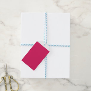 Een roze achtergrond met een witte rand cadeaulabel