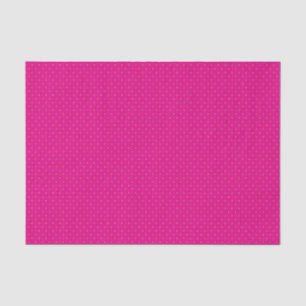 Een roze achtergrond met witte stippen tissuepapier