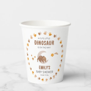 Een Schattigee kleine dinosaurus is op weg naar he Papieren Bekers