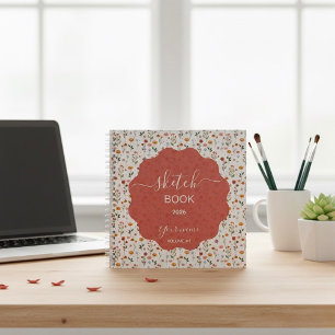 Een schetsboek ontworpen met bloemmotieven notitieboek
