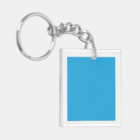 Een serene blauwe lucht met een paar verspreide wi sleutelhanger (Voorkant Links)