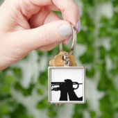 Een servicelid speelt een melodie sleutelhanger (Hand)