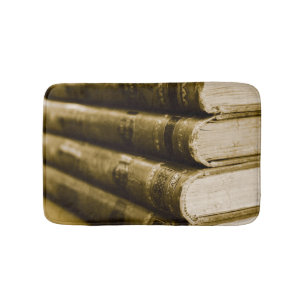 Een stapel oude boeken badmat
