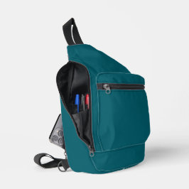 Een turkooisblauwe textuurachtergrond vult de afbe sling bag