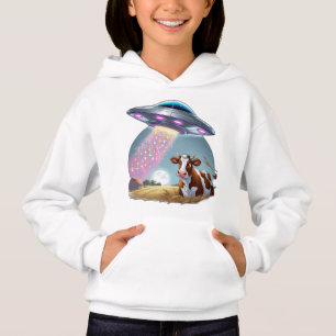 Een ufo ontvoert een koe, met de balk gemaakt van