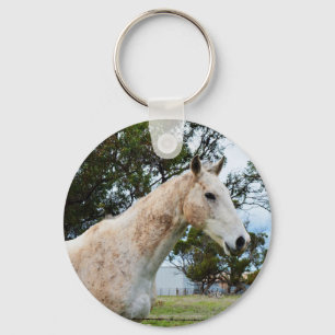 Een vies wit paard, sleutelhanger