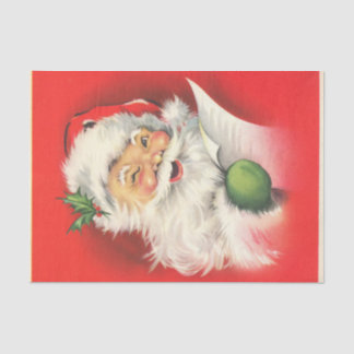 Een vrolijke knipogende kerstman die zijn lijst le tissuepapier