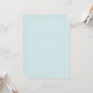 Een witte achtergrond met blauwe bloemen en groene kaart