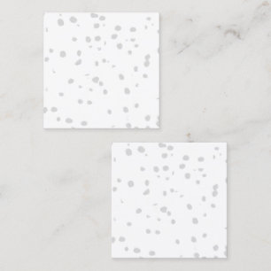 Een witte achtergrond met veel kleine stippen contactkaartje