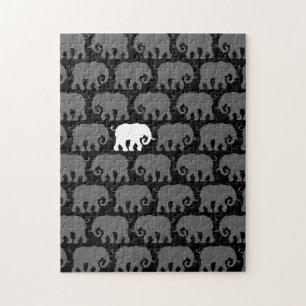 Eén witte olifant in een kudde legpuzzel