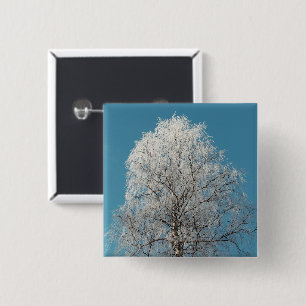 Een witte wilg tegen een wolkenloze blauwe hemel vierkante button 5,1 cm