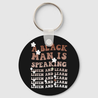 Een zwart Man spreekt, luistert en leert zijn zwar Sleutelhanger