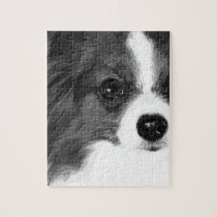 Een zwart-wit Papillon Legpuzzel