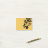 Een zwarte en gele handtekening van de luipaard post-it® notes (Op bureau)