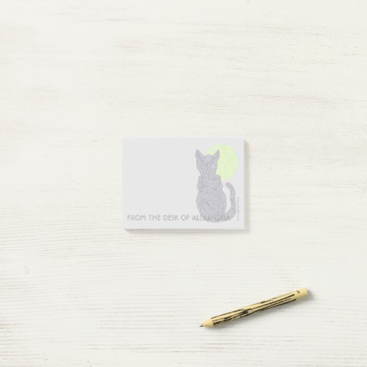 Een zwarte kat en een maan van het bureau van post-it® notes (Op bureau)