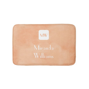 Eenvoudig en grafisch Oranje monogram met naam Badmat