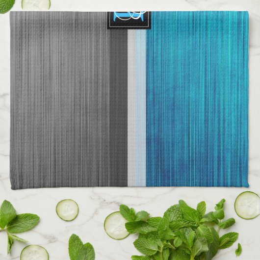 Eenvoudig monogram van twee tonnen blauw en grijze theedoek (Gevouwen)