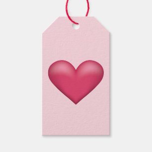 Eenvoudige roze hart op een lichtroze achtergrondk cadeaulabel