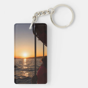 Egeïsche levensstijl op boot bij zonsondergang in sleutelhanger