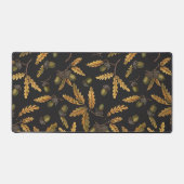 Eikels en eikenbladeren op zwart bureaumat (Voorkant)