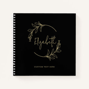 Elegant bloemenkrans monogram zwart goud notitieboek