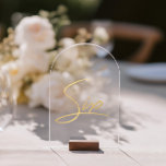 Elegant Gold Faux Foil Arch Acrylic Table Number<br><div class="desc">Please note: • The gold foil elements are simulated and printed digitally — they are not real foil. • Wood block stand is not included. Pair with matching stationery to create a cohesive and stylish celebration. • Add a touch of modern luxury to your wedding reception with this minimalist arched...</div>
