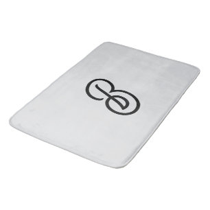 Elegant minimalistisch modern initiaal op grijs badmat