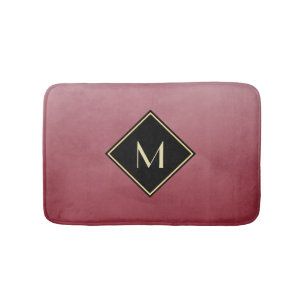 Elegant rood met eenvoudig goudmonogram badmat