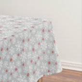 Elegant sneeuwvlokken wit en rood op grijs tafelkleed (Voorbeeld)