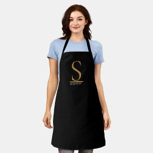Elegant zwart goud monogram meisjesachtig vrouweli schort