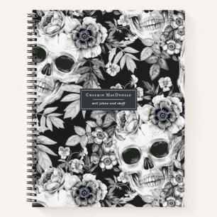 Elegante donkere bloemenschedels op zwart geperson notitieboek