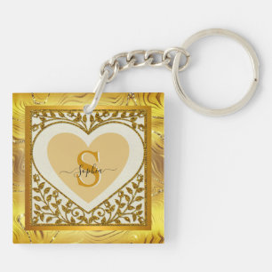 Elegante gouden glinsterende hart initiaal en naam sleutelhanger