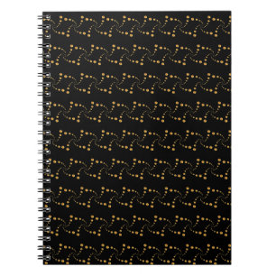 Elegante gouden wervelende stippen op zwart notitieboek