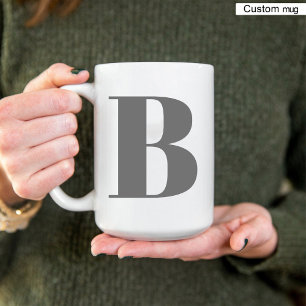 Elegante initiaal in zwart en wit monogramletter tweekleurige koffiemok