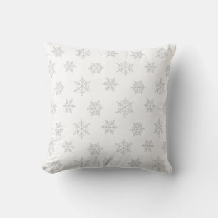 Elegante lichte grijze sneeuwvlokken op wit kussen