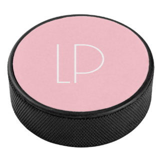 Elegante minimalistische moderne initiaal op paste hockey puck
