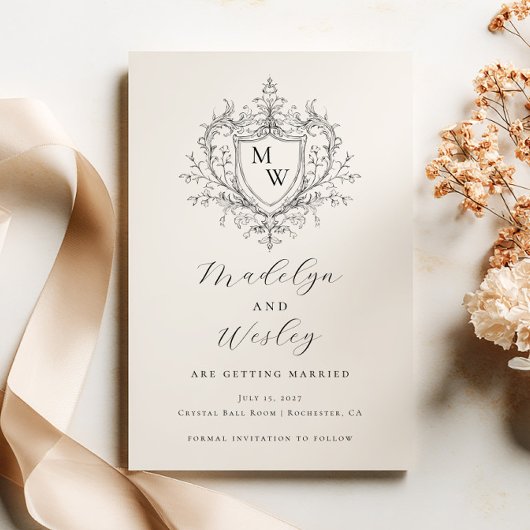 Elegante script monogram crest save the date