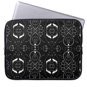 Elegante witte krullen en versieringen op zwart laptop sleeve