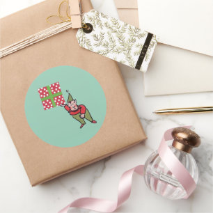 Elf met cadeau met polka stippen groene ronde grot sticker