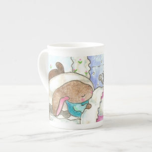 En Porcelaine Lapin dans le lit avec la tasse d'insectes