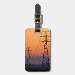 Energiemasten bij zonsondergang bagagelabel