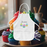Enfant Tablier de cuisson de cupcake personnalisé pour en<br><div class="desc">Tablier de cuisson de cupcake personnalisé pour les enfants. En beige,  jaune ou blanc. Drôle cadeau boulanger pour les petits enfants et les amateurs de cupcake. Fille design fille avec texte de script élégant. Image colorée aux couleurs pastel rose bleu vert etc. Fun anniversaire idée de fête.</div>